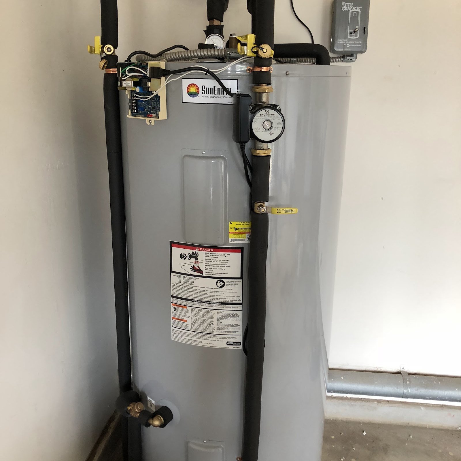 A newly installed water heater, connected and running